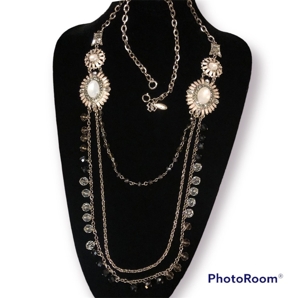 Ann Taylor gold-tone, long tired necklace.